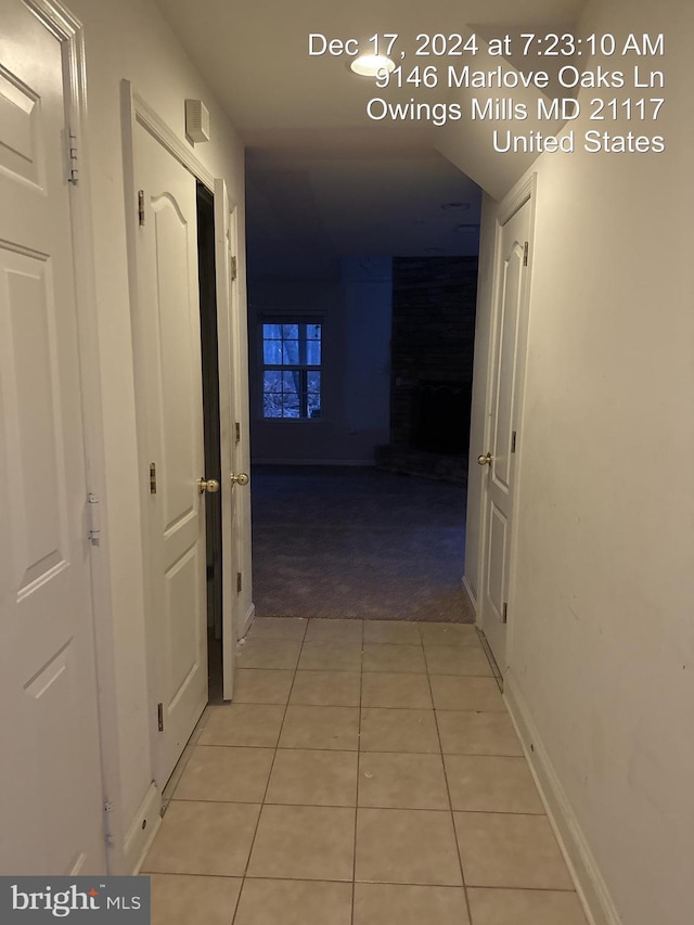 hallway with light tile patterned flooring