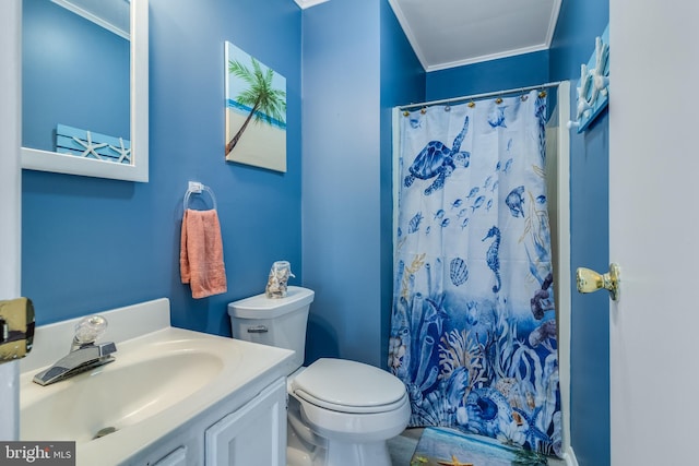 bathroom featuring curtained shower, crown molding, vanity, and toilet