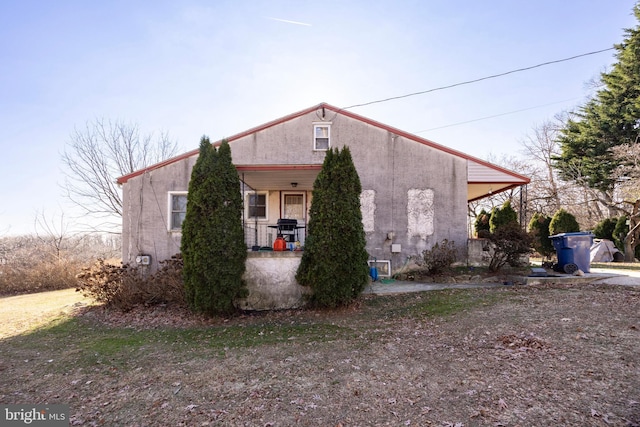 view of home's exterior featuring a porch