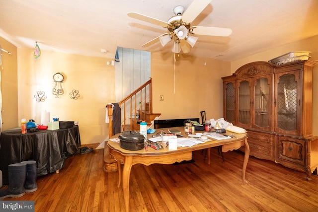 dining space featuring ceiling fan and wood-type flooring