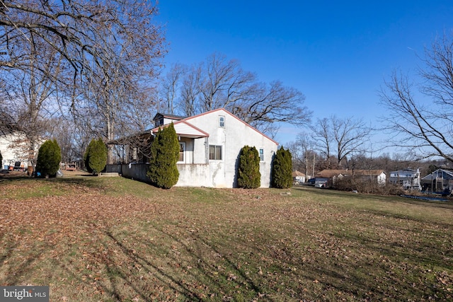 view of home's exterior featuring a lawn