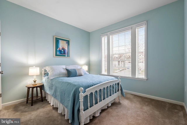 bedroom featuring carpet floors and multiple windows