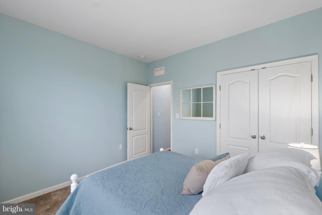 carpeted bedroom featuring a closet