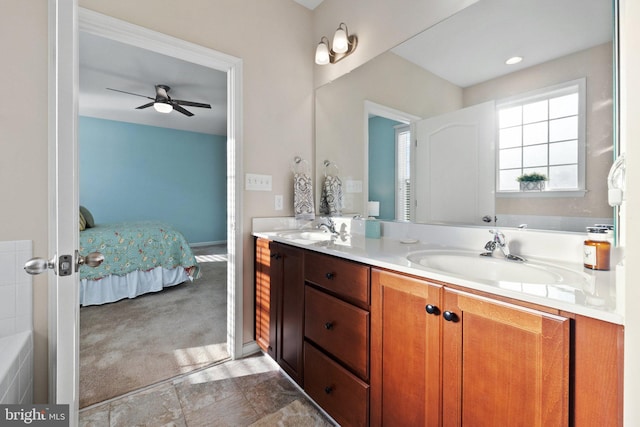 bathroom with ceiling fan and vanity