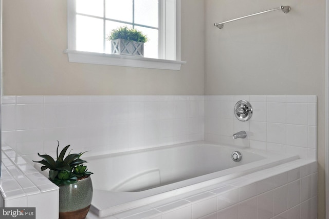 bathroom with tiled tub