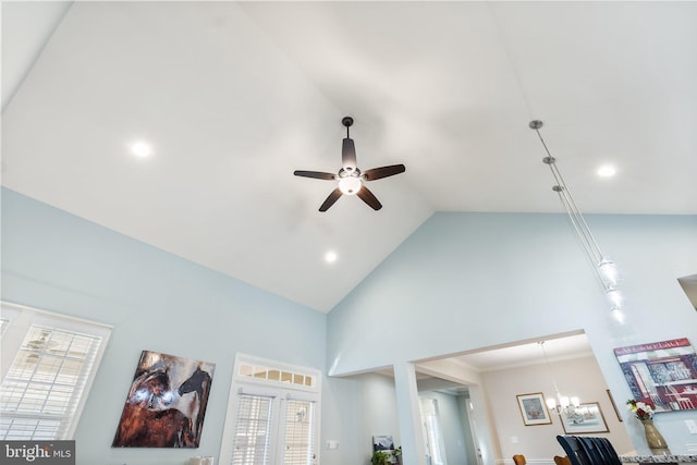 room details featuring ceiling fan with notable chandelier