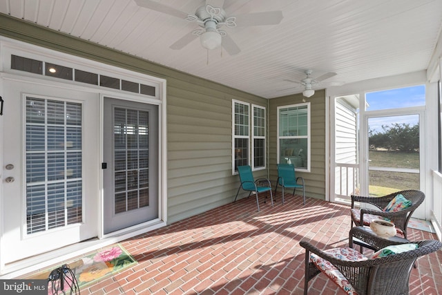 exterior space featuring ceiling fan