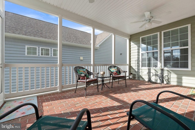 sunroom / solarium with ceiling fan