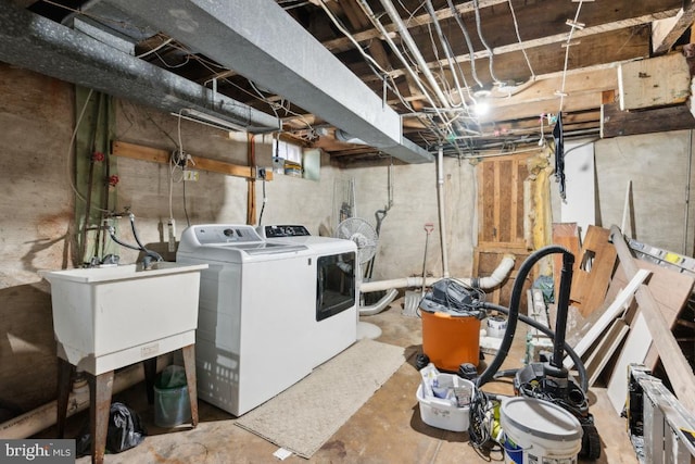 washroom with sink and washer and dryer