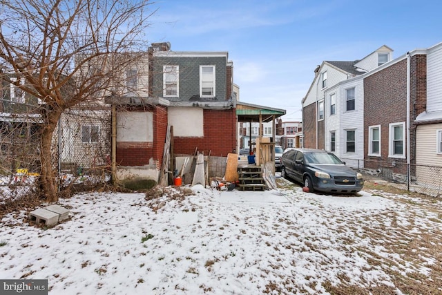 view of snow covered house