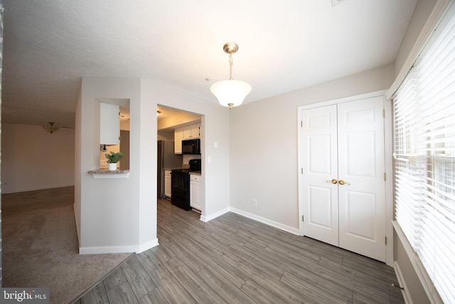 spare room with hardwood / wood-style flooring