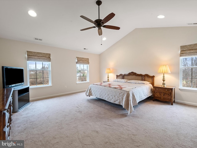 carpeted bedroom featuring ceiling fan and vaulted ceiling