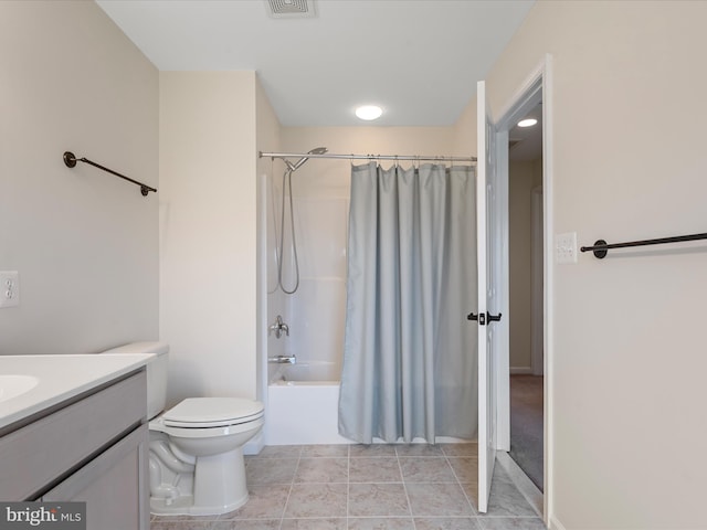 full bathroom featuring tile patterned floors, vanity, toilet, and shower / tub combo with curtain