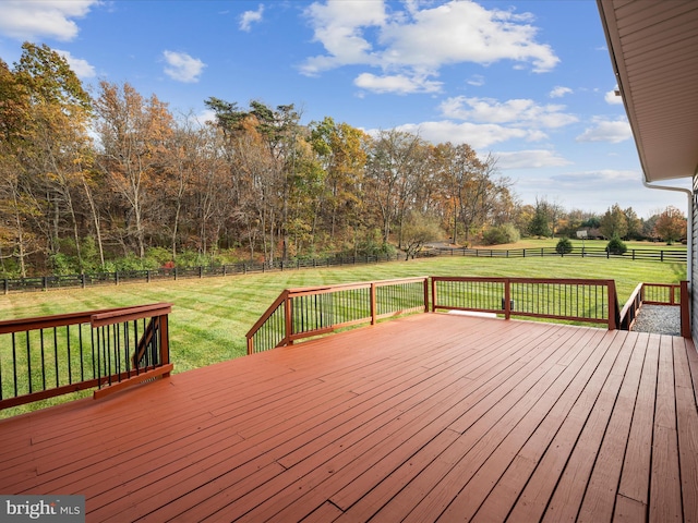 wooden deck with a lawn