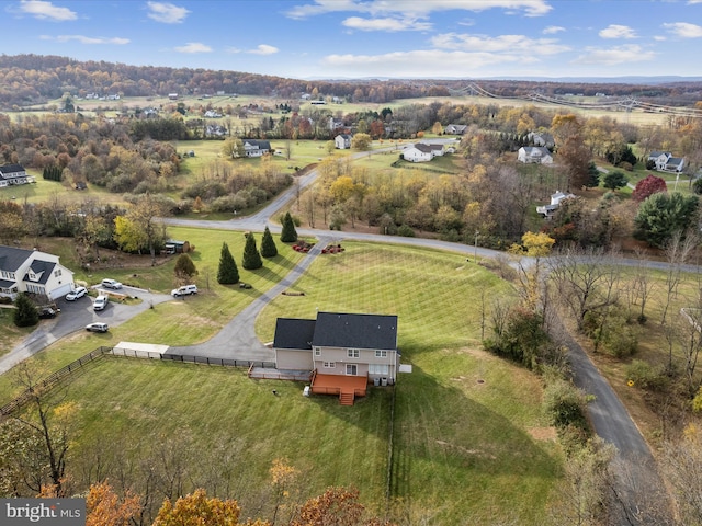 birds eye view of property with a rural view