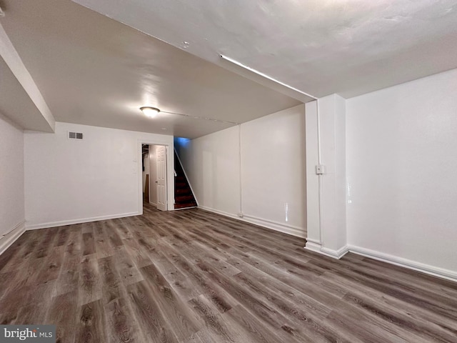 basement featuring dark wood-type flooring