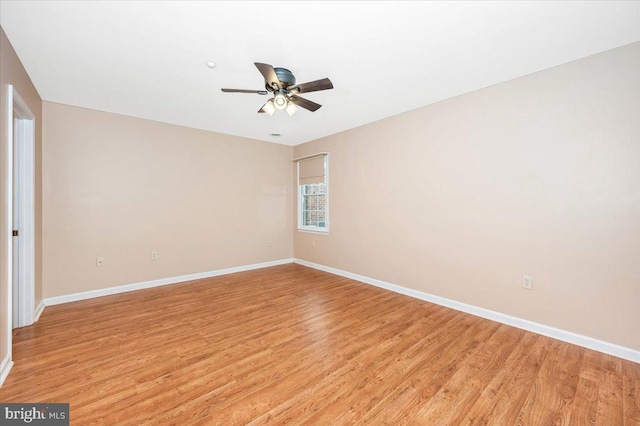 empty room featuring light hardwood / wood-style flooring and ceiling fan