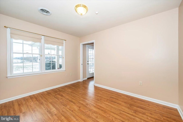 unfurnished room featuring light hardwood / wood-style flooring