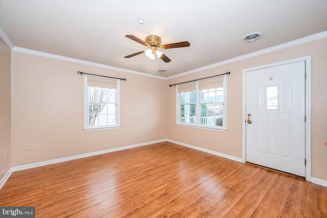 foyer entrance with ceiling fan, light hardwood / wood-style floors, and crown molding