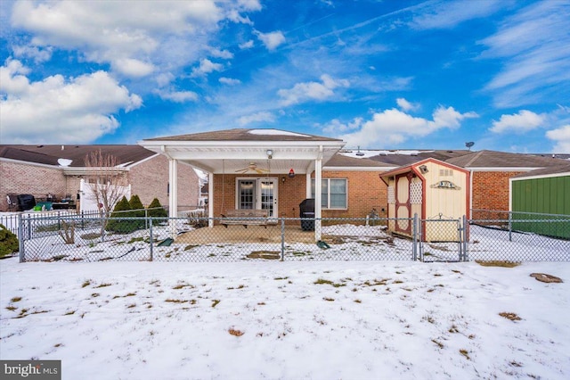 snow covered house with ceiling fan