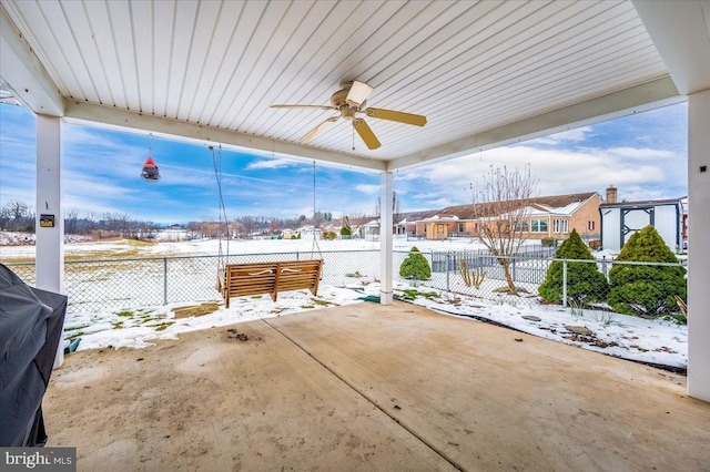 snow covered patio with ceiling fan