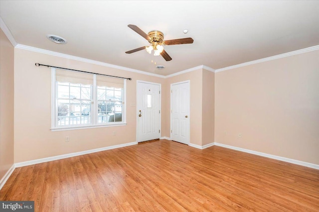 empty room with ceiling fan, light hardwood / wood-style floors, and ornamental molding