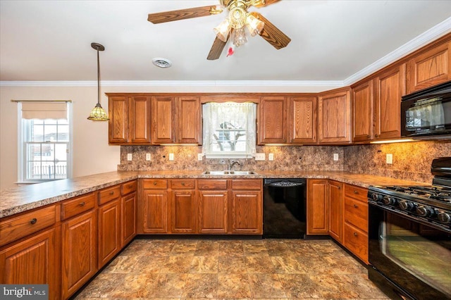 kitchen featuring sink, kitchen peninsula, decorative light fixtures, black appliances, and ornamental molding