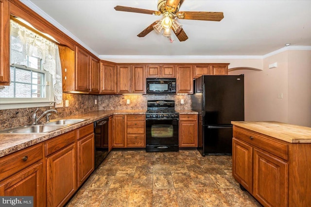 kitchen featuring ceiling fan, sink, backsplash, black appliances, and ornamental molding