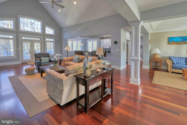 living room featuring ornate columns, ceiling fan, dark hardwood / wood-style flooring, and high vaulted ceiling