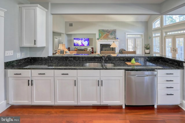 kitchen with dishwasher, dark hardwood / wood-style floors, white cabinetry, and sink