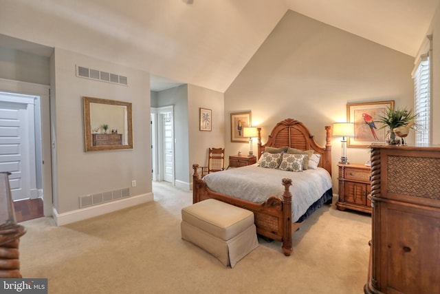 bedroom with light carpet and vaulted ceiling