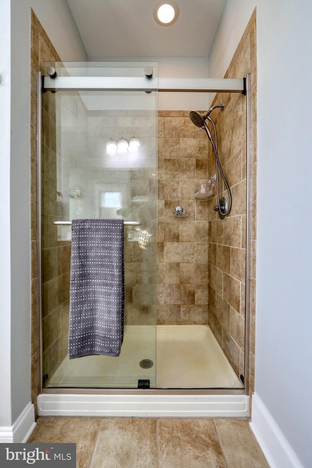 bathroom featuring tile patterned floors and walk in shower