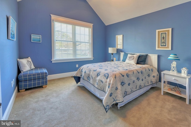 bedroom with carpet and lofted ceiling