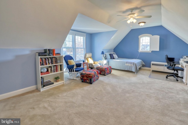 carpeted bedroom with ceiling fan and lofted ceiling