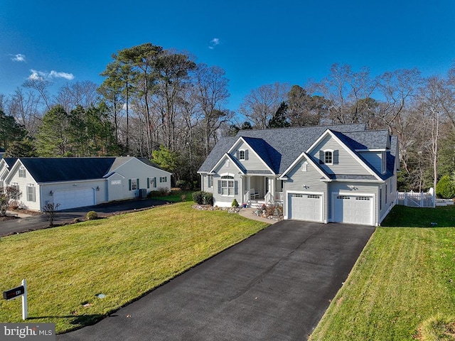 view of front facade with a front yard and a garage