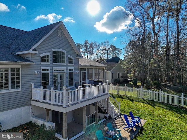 back of house with a yard, a patio, french doors, and a deck