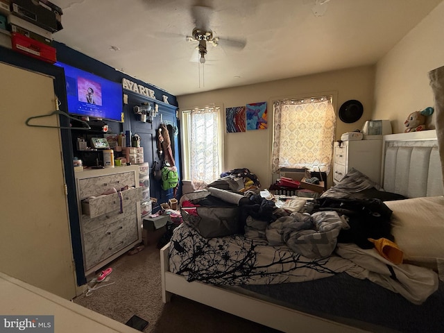 bedroom with ceiling fan and carpet flooring