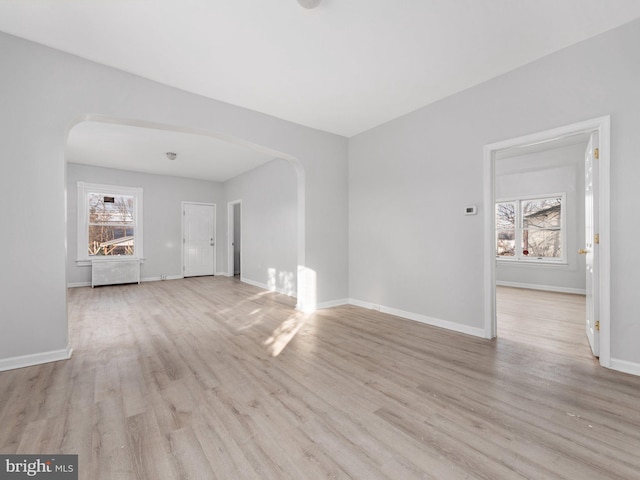 spare room featuring light hardwood / wood-style floors