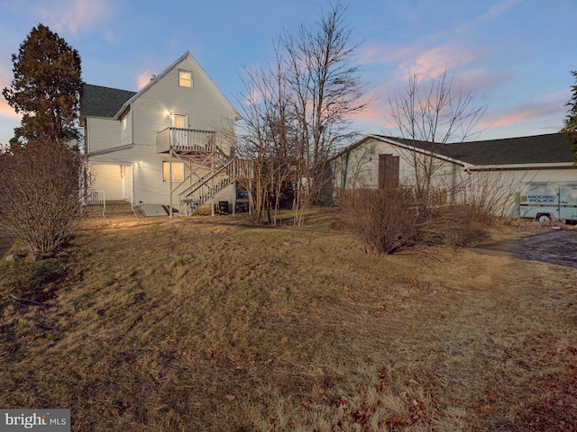 view of back house at dusk