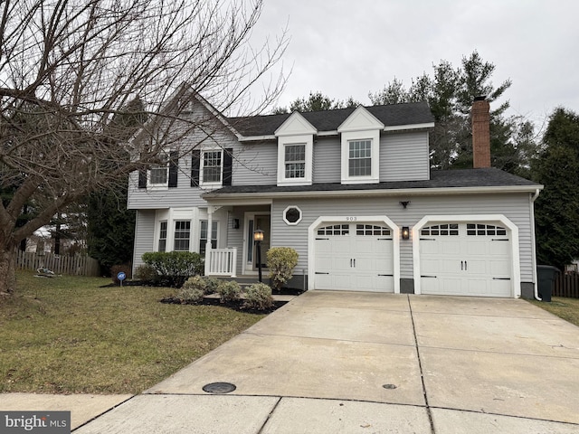 view of front of home with a garage and a front yard