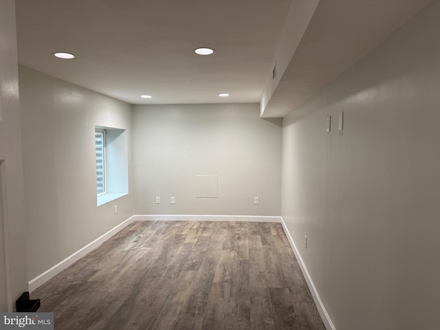 basement with dark wood-type flooring