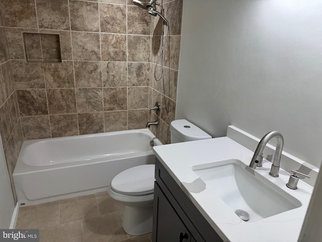 full bathroom with tile patterned flooring, vanity, toilet, and tiled shower / bath