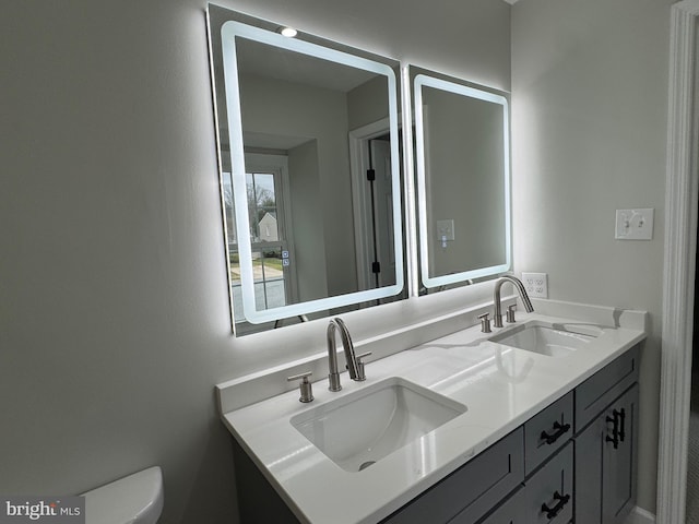 bathroom with vanity and toilet