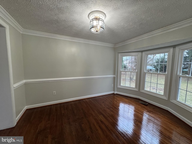 unfurnished room featuring crown molding, dark hardwood / wood-style flooring, and a textured ceiling