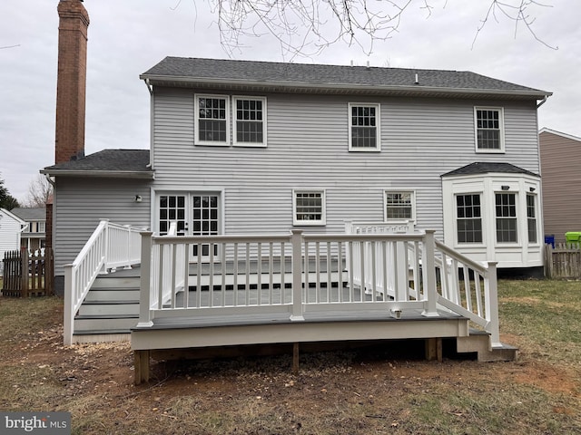 back of house featuring a wooden deck