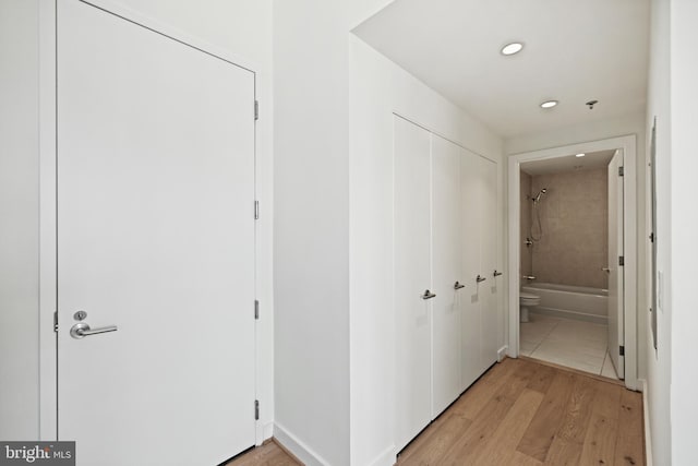 corridor featuring recessed lighting and light wood-type flooring