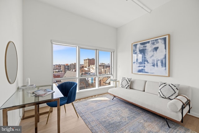 interior space featuring a view of city and wood finished floors