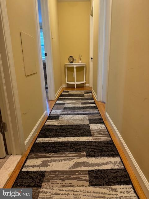 hallway featuring hardwood / wood-style floors