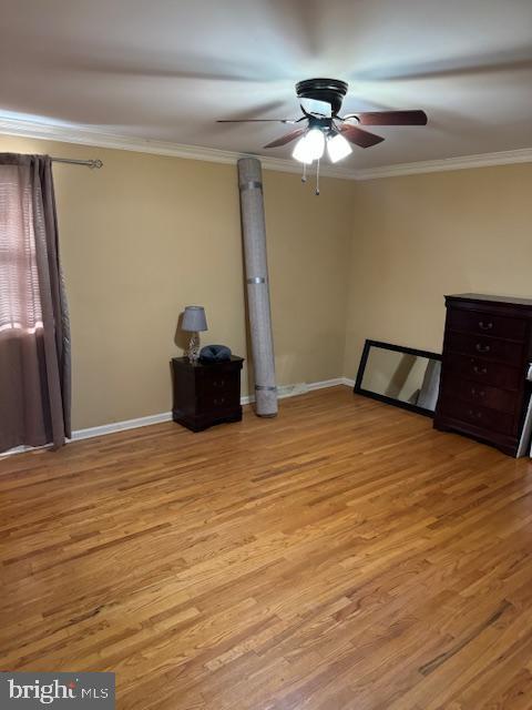 unfurnished bedroom with light hardwood / wood-style floors, ceiling fan, and ornamental molding