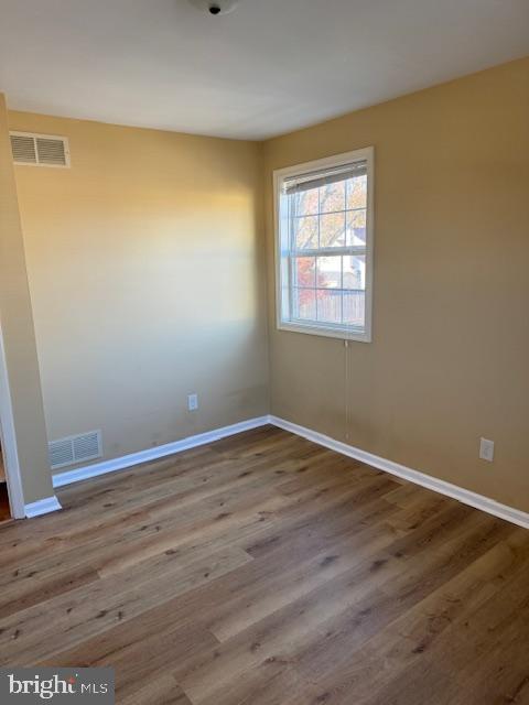 spare room with light hardwood / wood-style floors